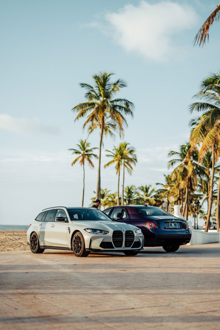 BMW G81 M3 Touring Wagon with Rolls Royce on the beach